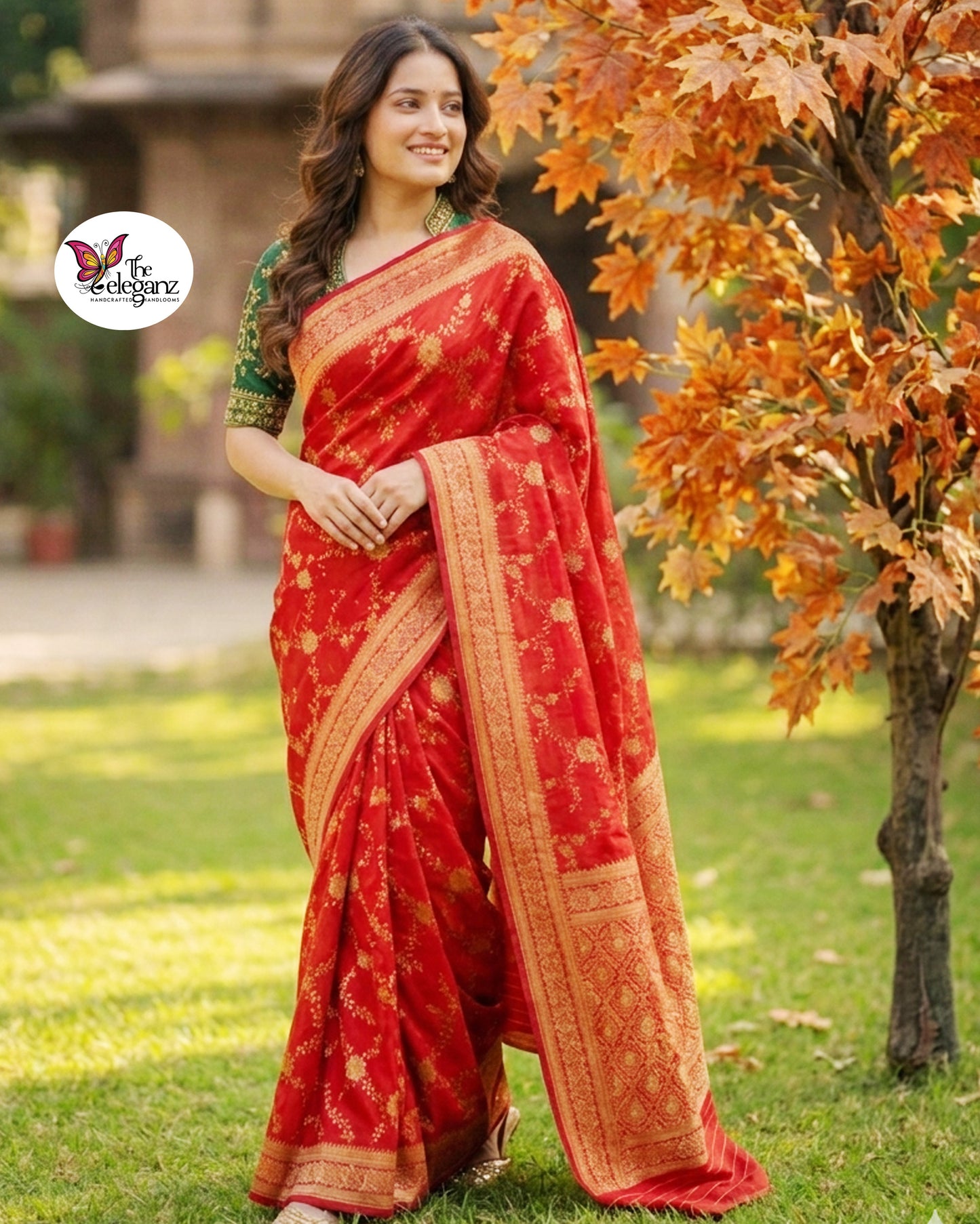 Woman draped in vermilion red Semi Mashroo Katan Silk Banarasi saree featuring floral gold zari weaving and richly woven Banarasi paisley pallu.