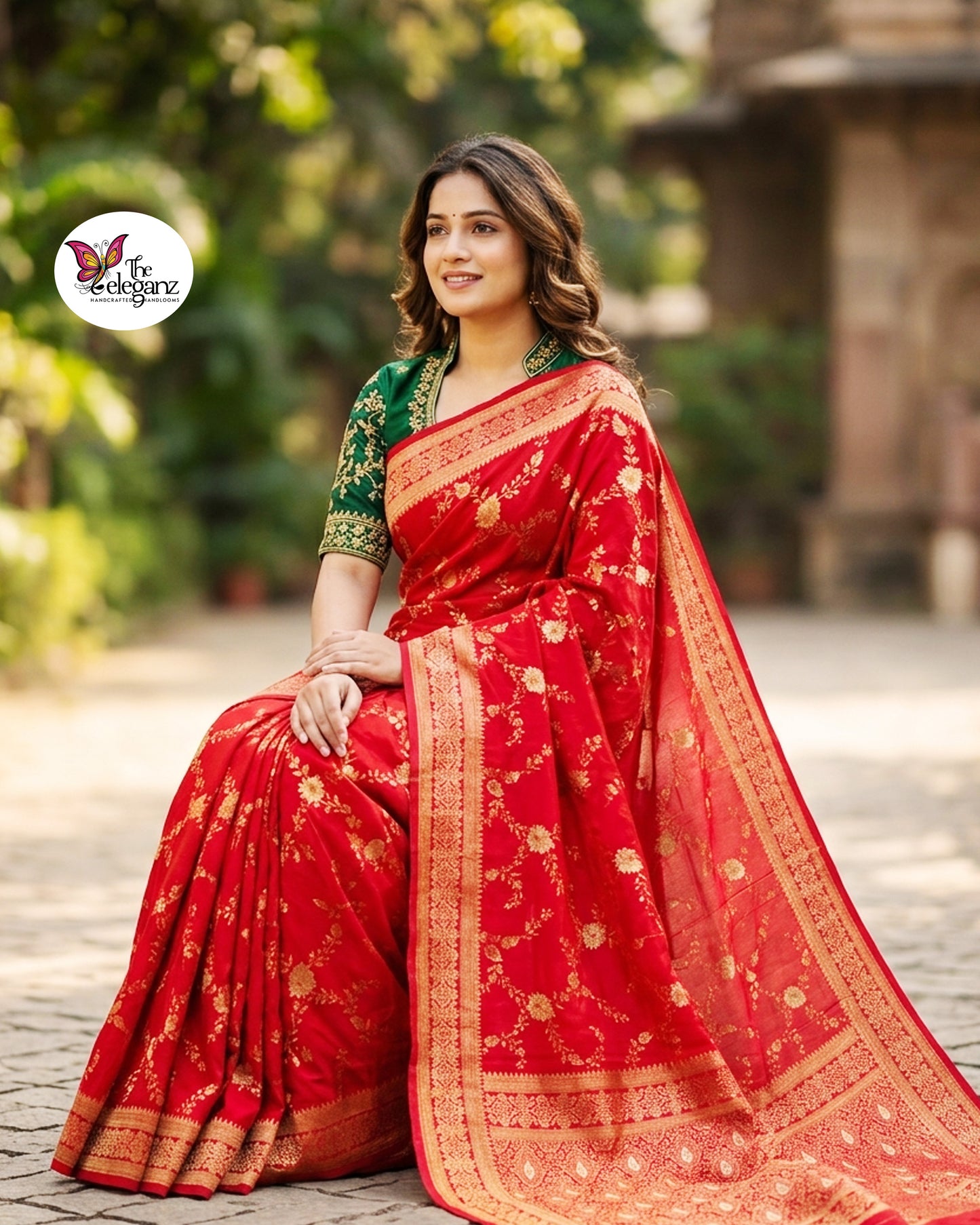 Woman draped in vermilion red Semi Mashroo Katan Silk Banarasi saree featuring floral gold zari weaving and richly woven Banarasi paisley pallu.