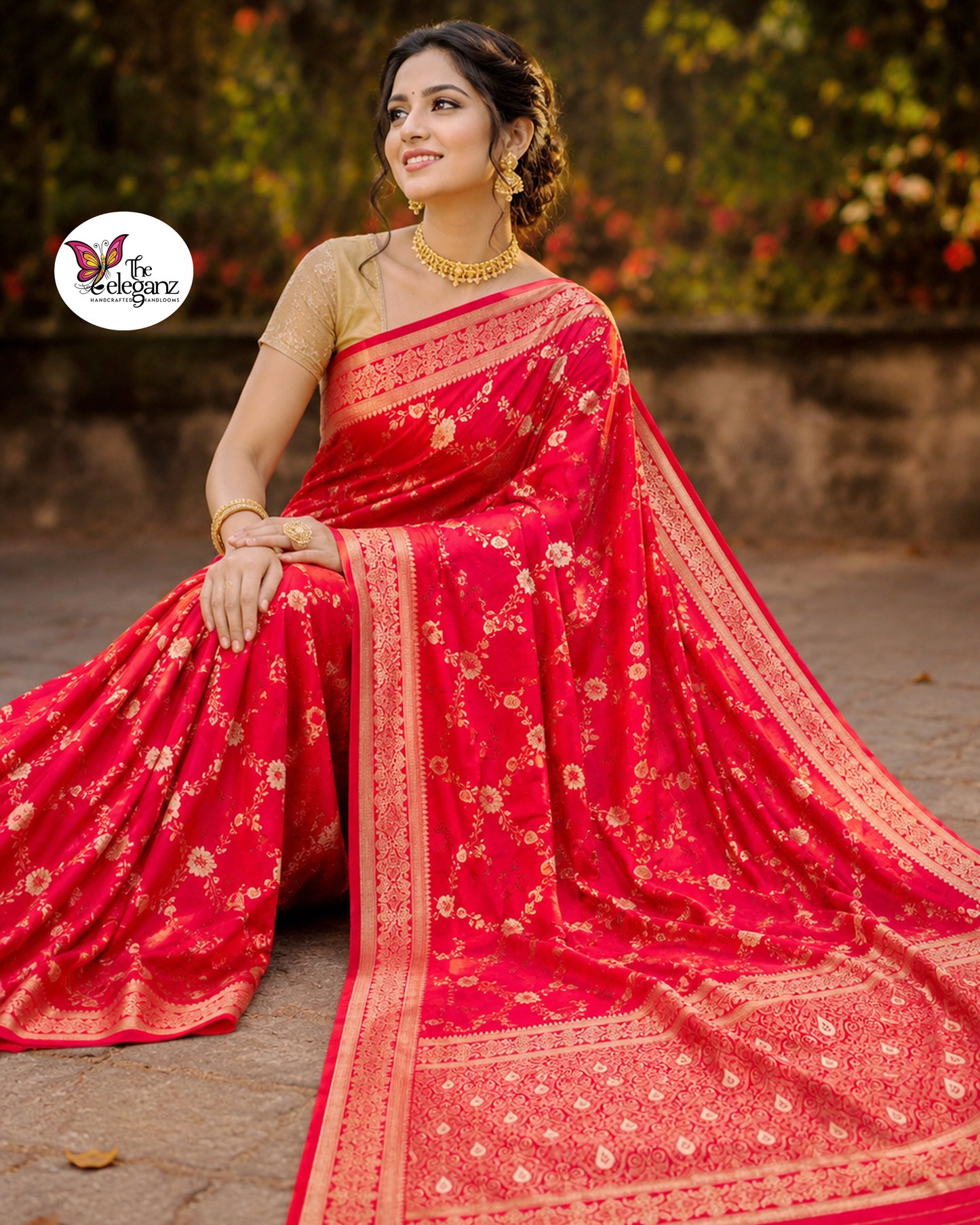 Woman draped in vermilion red Semi Mashroo Katan Silk Banarasi saree featuring floral gold zari weaving and richly woven Banarasi paisley pallu.