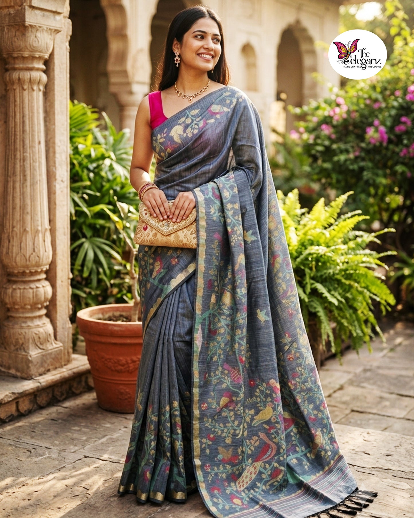 Woman draped in a smoky grey semi tussar silk saree featuring woven bird, floral, and vine motifs across the border and pallu with matching blouse piece.